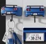 Blue R34-style sports car wall key holder, rear view with keys hanging