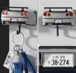 Silver R34-style sports car wall key holder, rear view with keys hanging