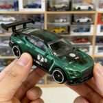 Green GT3 race car diecast rear wing close up