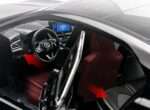 Black executive sedan diecast interior with red seats