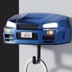 Blue R34-style sports car wall key holder with headlights on